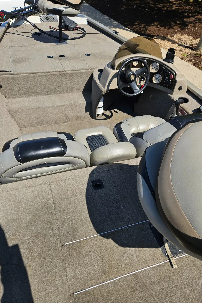 Slide: The Image of 2010 G3 180 boat interior with steering console and seating. - 1