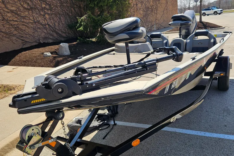 Slide: The Image of 2010 G3 180 boat on trailer, equipped with fishing seats and trolling motor. - 3