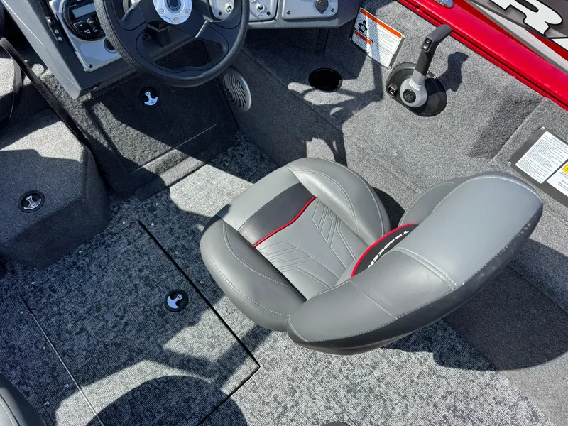 Slide: The Image of 2025 Tracker Pro Guide V-175 Combo boat interior with gray seating and steering wheel. - 9
