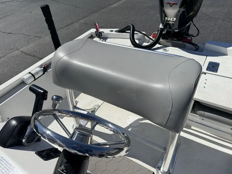 Slide: The Image of Avid 19 FS 2022 boat interior with steering wheel and seat. - 18