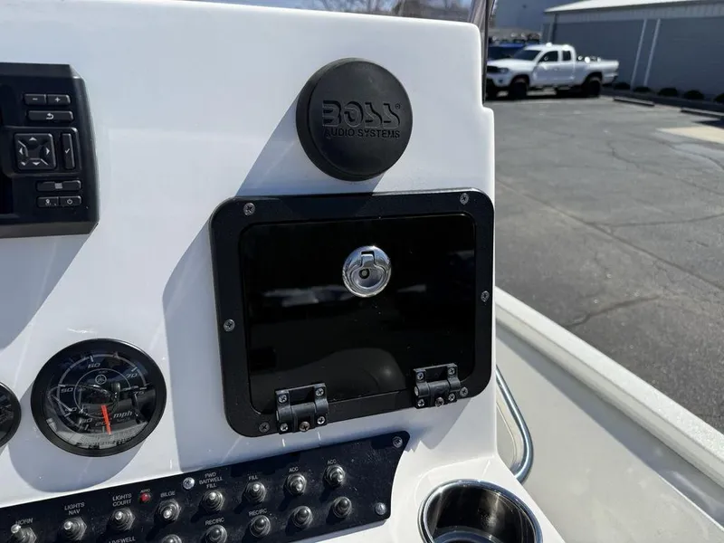 Slide: The Image of Control panel of 2022 Avid 19 FS boat with Boss audio system. - 21