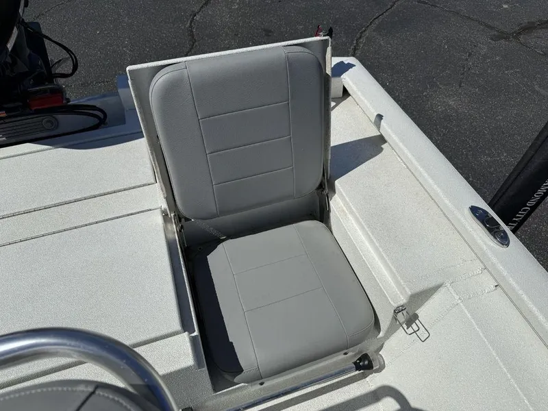 Slide: The Image of Avid 19 FS 2022 boat with a gray cushioned seat on deck. - 27