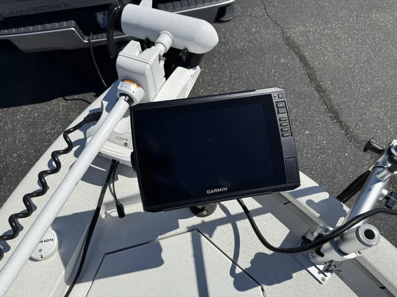 Slide: The Image of Garmin fishfinder on 2022 Avid 19 FS boat deck with trolling motor. - 7