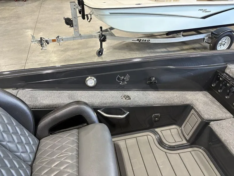 Slide: The Image of Interior of a 2025 Phoenix 721 ZXL boat with quilted seating and sleek design. - 18