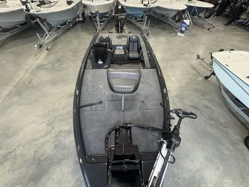 Slide: The Image of 2025 Phoenix 721 ZXL bass boat in showroom, featuring spacious deck and modern design. - 22