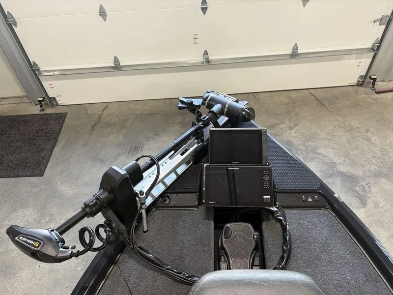 Slide: The Image of 2025 Phoenix 721 ZXL boat with advanced navigation and control systems in a garage setting. - 3