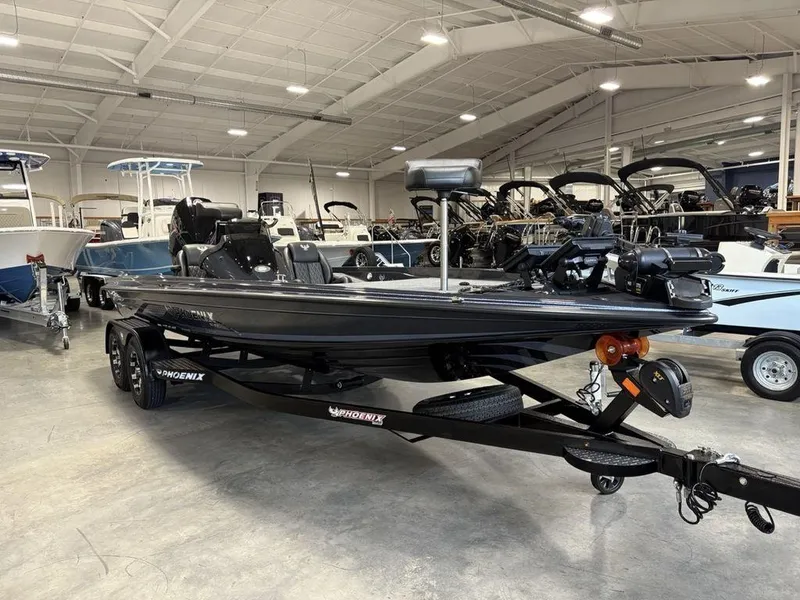 Slide: The Image of 2025 Phoenix 721 ZXL boat in showroom, sleek design, black finish, on trailer. - 4