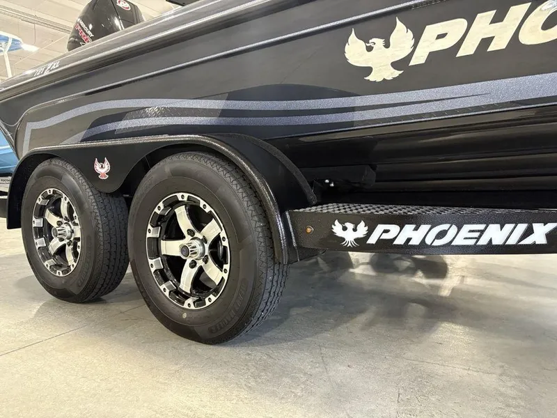 Slide: The Image of 2025 Phoenix 721 ZXL boat trailer with dual wheels and sleek design. - 6