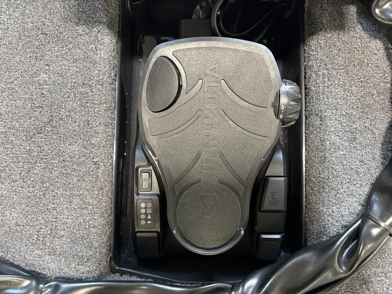 Slide: The Image of Foot pedal control in a 2025 Phoenix 721 ZXL boat, featuring Minn Kota branding. - 8