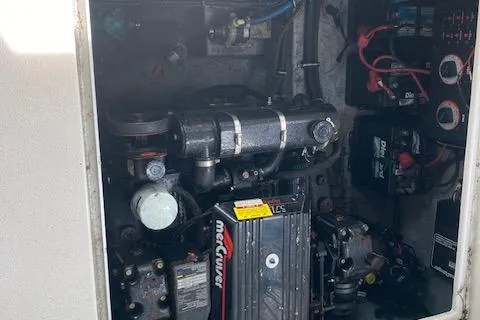 Slide: The Image of Engine compartment of a 1997 Chaparral 31 boat, featuring a MerCruiser engine. - 14