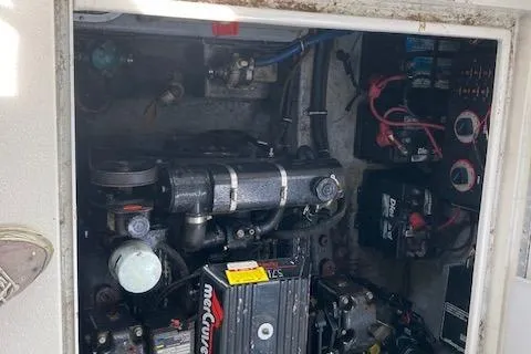 Slide: The Image of Engine compartment of a 1997 Chaparral 31 boat, featuring a MerCruiser engine. - 15
