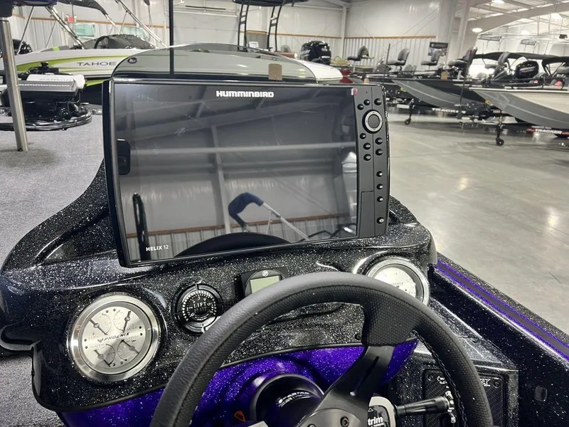 Slide: The Image of Dashboard of 2025 Phoenix 920 Elite boat with Humminbird Helix 12 display. - 14