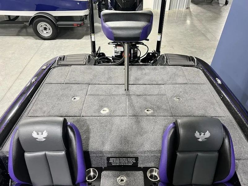 Slide: The Image of 2025 Phoenix 920 Elite boat interior with gray and purple seating, featuring a spacious deck. - 15