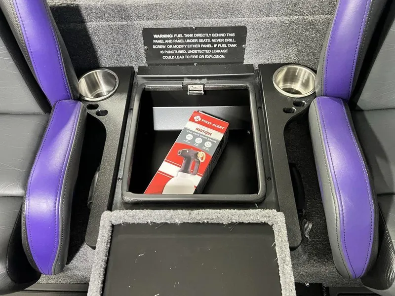 Slide: The Image of Interior of 2025 Phoenix 920 Elite with storage compartment and fire extinguisher. - 22