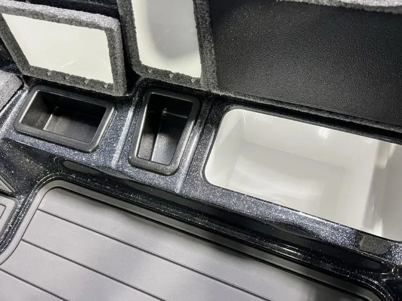 Slide: The Image of Interior compartments of 2025 Phoenix 920 Elite boat, featuring sleek storage design. - 24