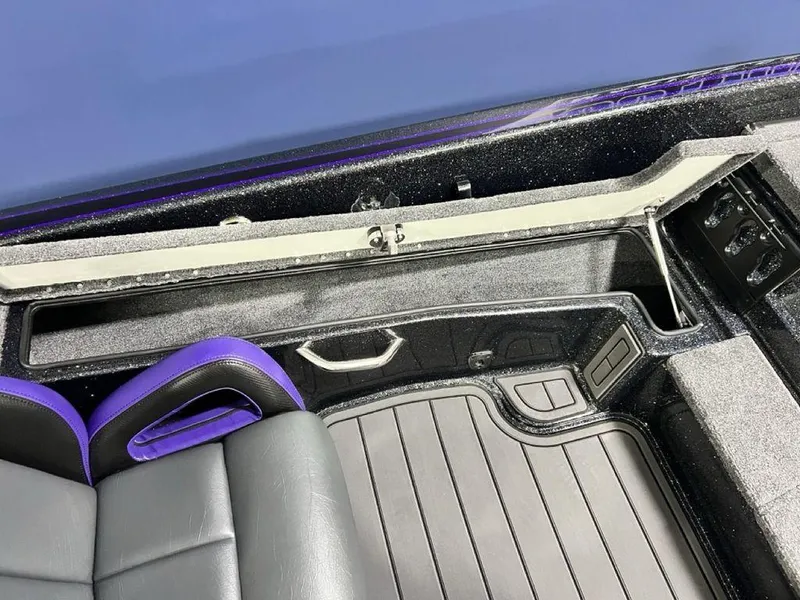 Slide: The Image of Interior of 2025 Phoenix 920 Elite boat with sleek seating and storage compartments. - 32