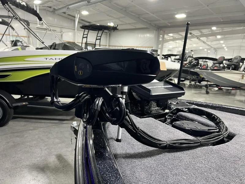 Slide: The Image of Phoenix 920 Elite 2025 boat in showroom, featuring advanced equipment and sleek design. - 9