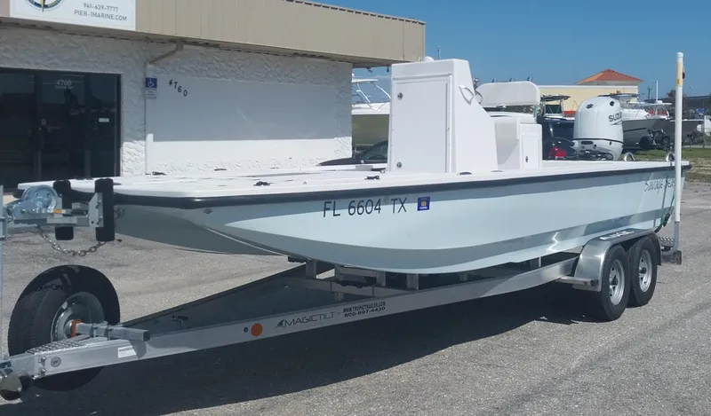 The Image of 2024 Savage Seas Shallow Bay SS22 boat on a trailer, parked outdoors. - 1