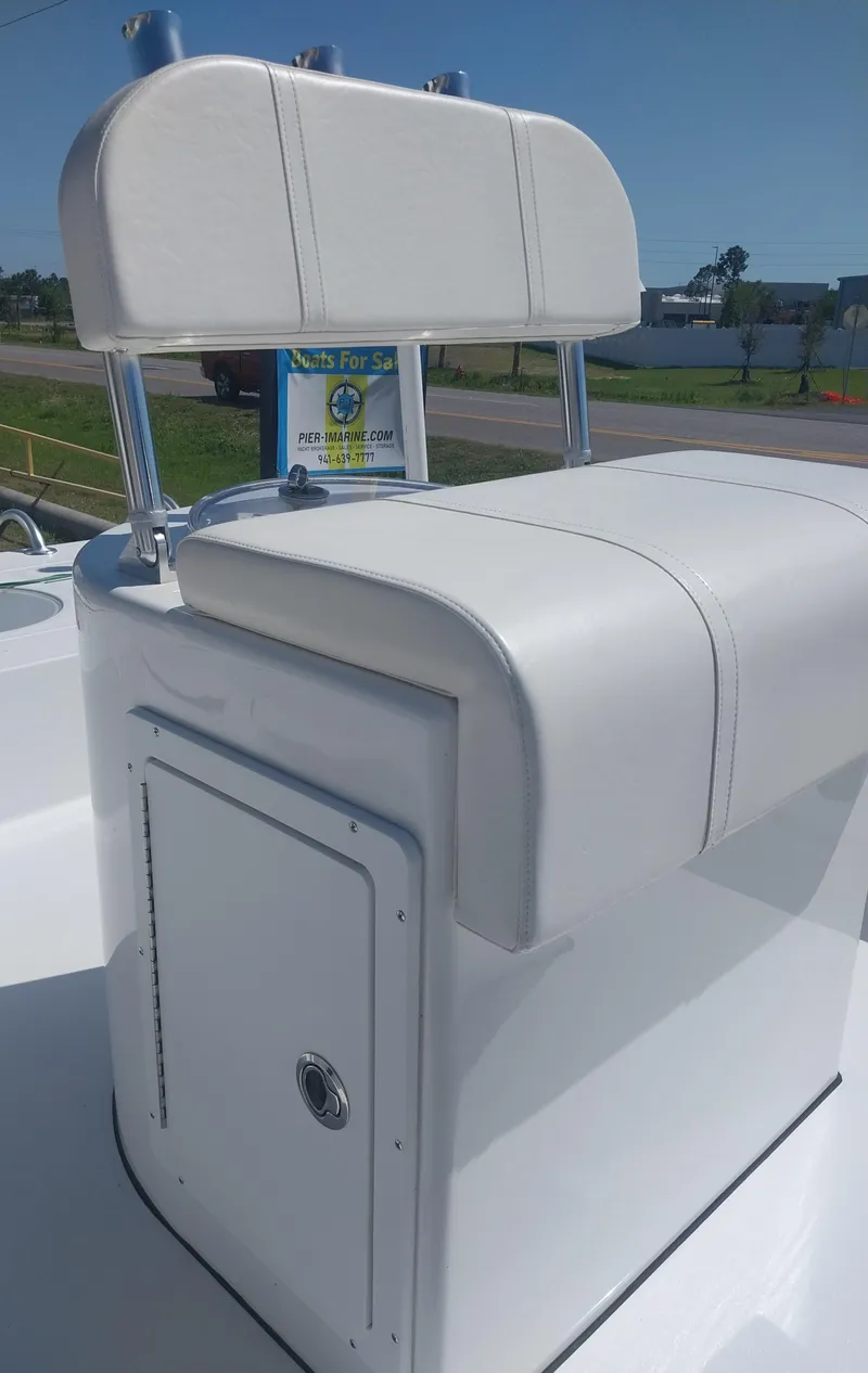 Slide: The Image of 2024 Savage Seas Shallow Bay SS22 boat seat, white upholstery, outdoor setting. - 13