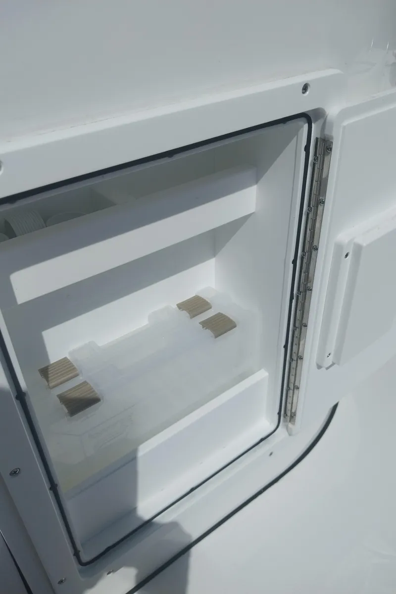 Slide: The Image of 2024 Savage Seas Shallow Bay SS22 storage compartment, open and empty, showcasing interior design. - 15