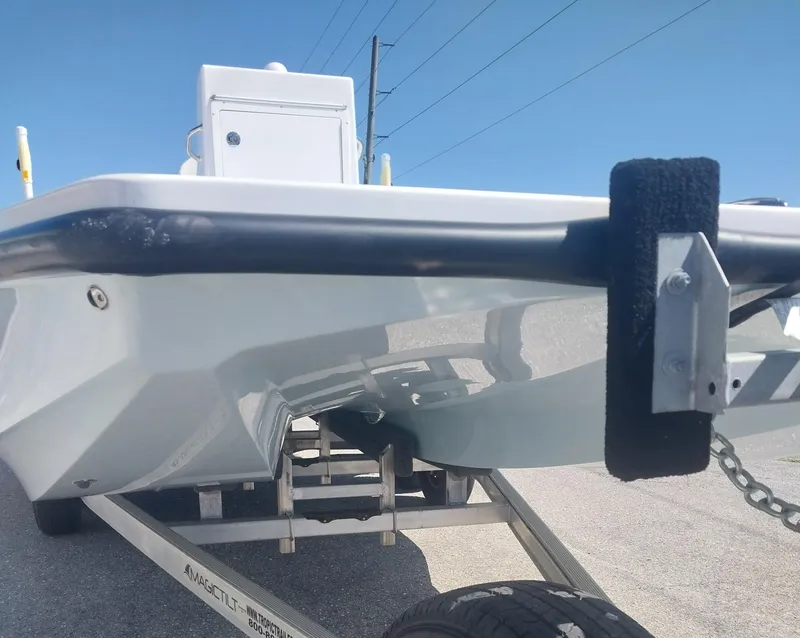 Slide: The Image of 2024 Savage Seas Shallow Bay SS22 boat on trailer, viewed from the front. - 5