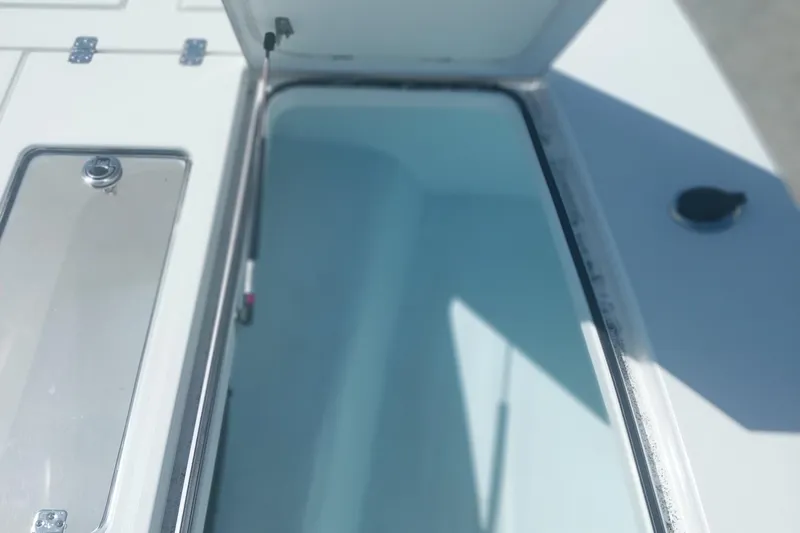 Slide: The Image of Open storage compartment on 2024 Savage Seas Shallow Bay SS22 boat. - 7