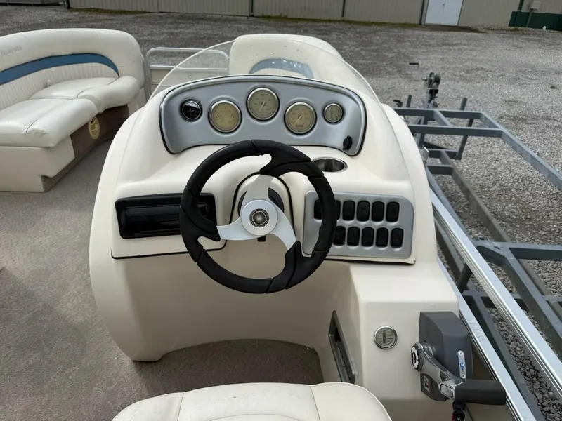 Slide: The Image of 2007 Godfrey Aqua Patio 200 RE 3 boat dashboard with steering wheel and gauges. - 9