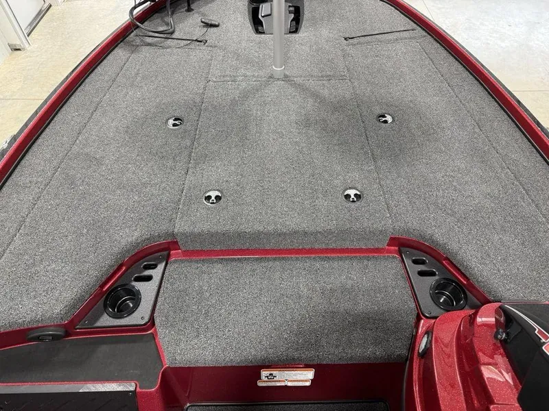Slide: The Image of 2025 Nitro Z18 Pro boat deck with gray carpet and red trim. - 10