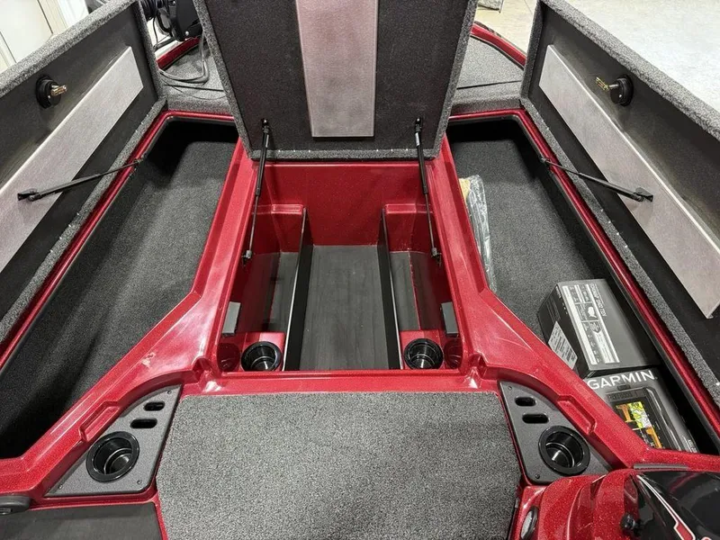 Slide: The Image of Interior of 2025 Nitro Z18 Pro boat with storage compartments and Garmin equipment. - 11