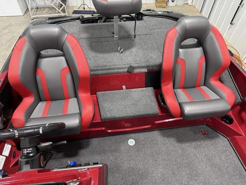 Slide: The Image of 2025 Nitro Z18 Pro boat interior with red and gray seats, steering wheel visible. - 13