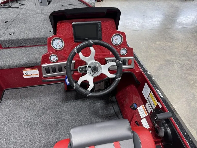 Slide: The Image of Cockpit of 2025 Nitro Z18 Pro boat with steering wheel and dashboard controls. - 14
