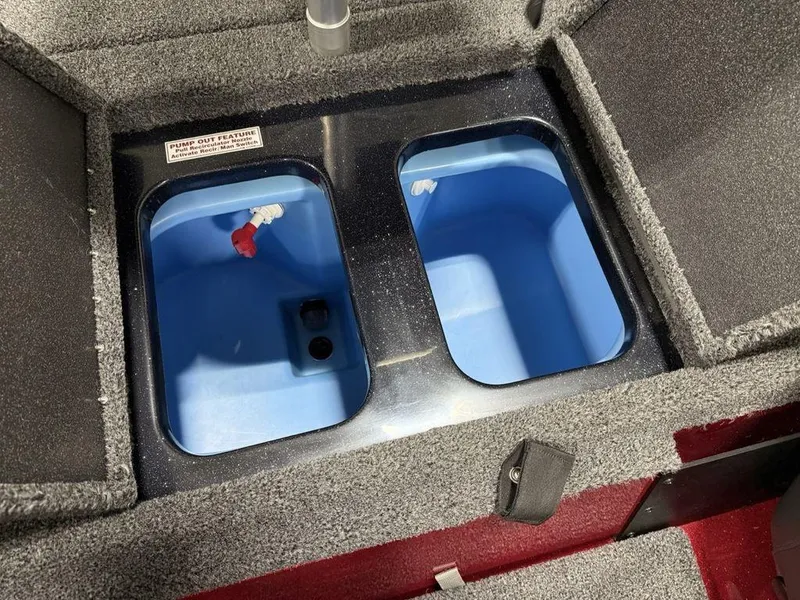 Slide: The Image of Interior compartments of 2025 Nitro Z18 Pro boat, featuring dual blue storage bins. - 17