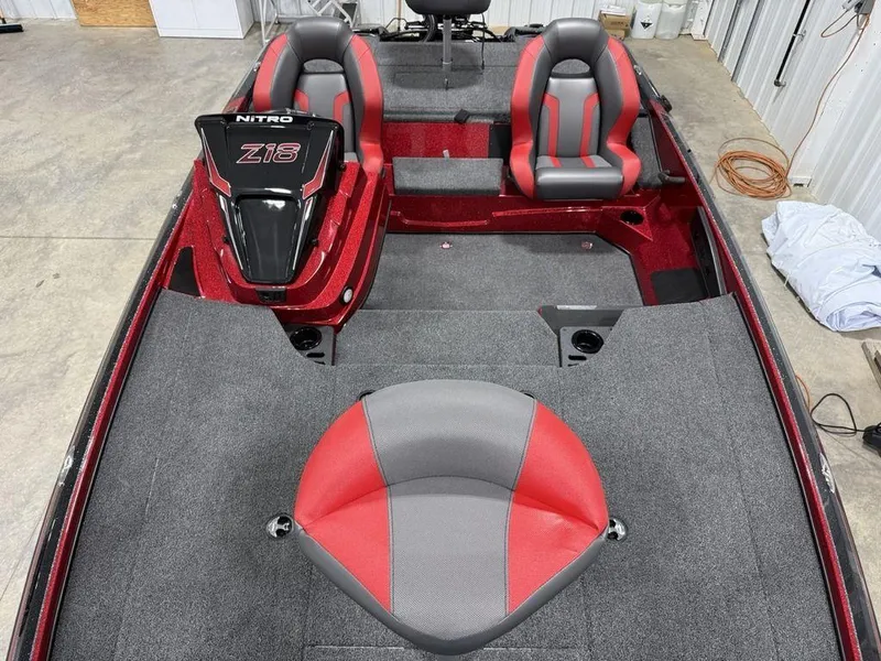 Slide: The Image of 2025 Nitro Z18 Pro boat interior with red and gray seating, spacious layout. - 22