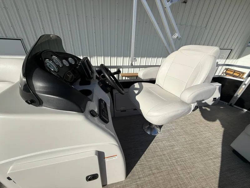 Slide: The Image of Captain's seat and console of 2018 Landau Island Breeze 212C pontoon boat. - 10