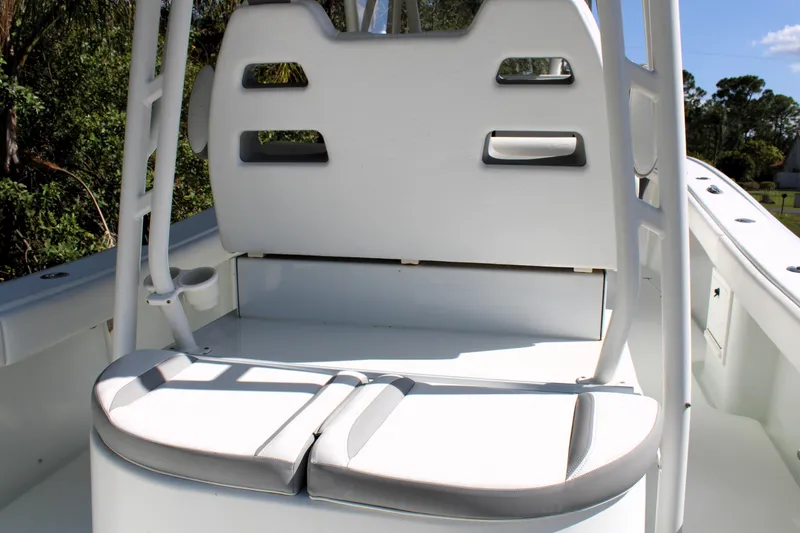 Slide: The Image of 2007 Yellowfin 36 Offshore boat seating area with white cushions and backrest. - 12