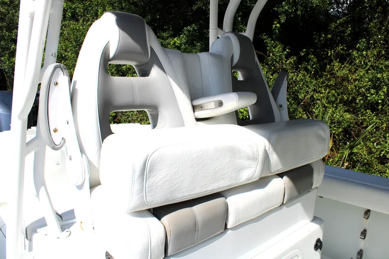 Slide: The Image of 2007 Yellowfin 36 Offshore boat seating with white cushioned seats and armrests. - 15