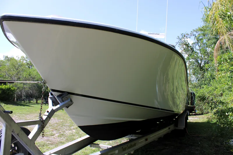 Slide: The Image of 2007 Yellowfin 36 Offshore boat on trailer, side view in outdoor setting. - 2