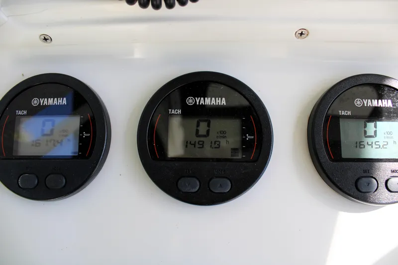Slide: The Image of Yamaha tachometers on a 2007 Yellowfin 36 Offshore boat dashboard. - 20
