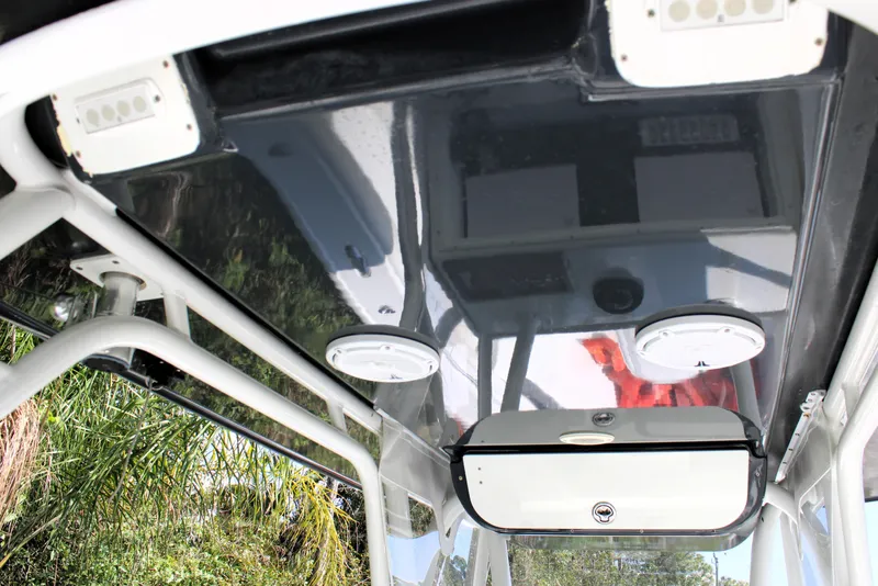 Slide: The Image of 2007 Yellowfin 36 Offshore boat interior ceiling with storage and lighting fixtures. - 21