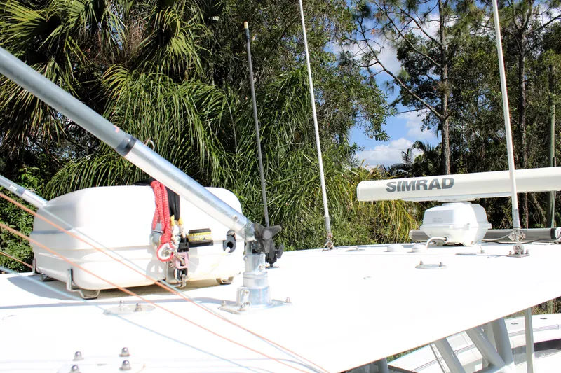 Slide: The Image of 2007 Yellowfin 36 Offshore boat with Simrad radar, surrounded by lush greenery. - 22