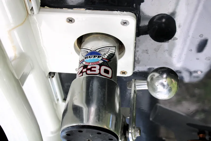 Slide: The Image of Close-up of a 2007 Yellowfin 36 Offshore boat control lever and throttle. - 24