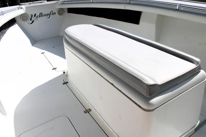 Slide: The Image of 2007 Yellowfin 36 Offshore boat interior with cushioned seating and storage. - 25