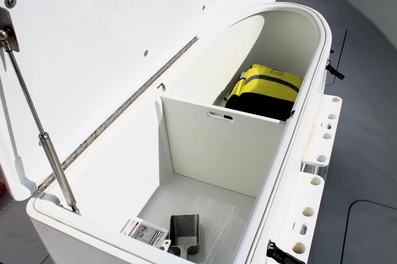 Slide: The Image of Storage compartment on 2007 Yellowfin 36 Offshore boat with life jacket and accessories. - 27