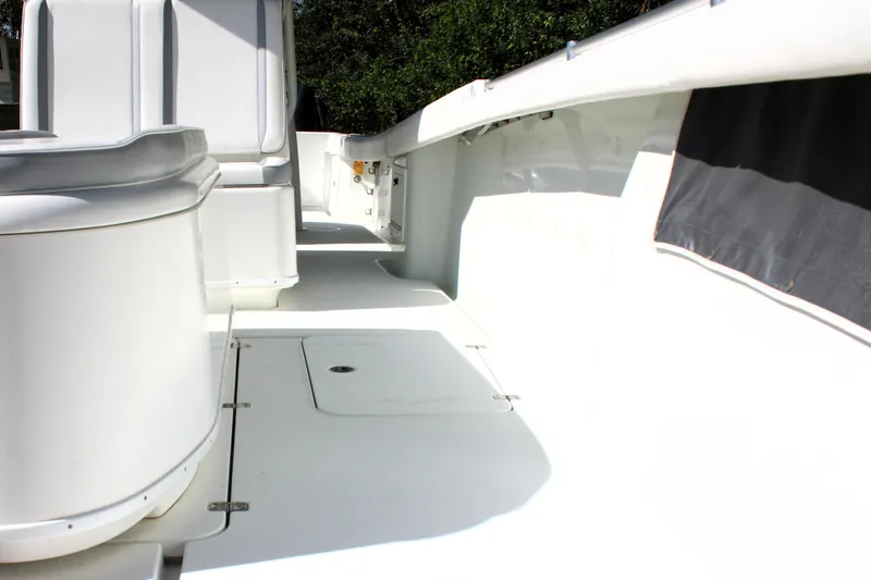 Slide: The Image of 2007 Yellowfin 36 Offshore boat deck, featuring spacious white interior and seating. - 28