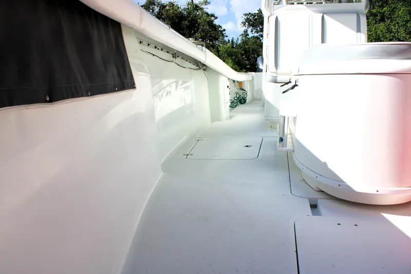 Slide: The Image of 2007 Yellowfin 36 Offshore boat deck, featuring sleek white design and spacious layout. - 29