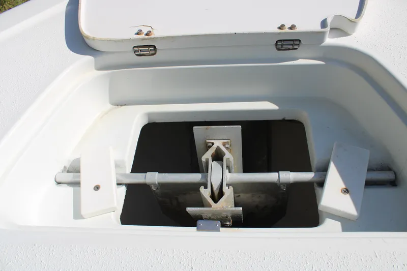 Slide: The Image of Anchor compartment of 2007 Yellowfin 36 Offshore boat, featuring a secured anchor. - 33