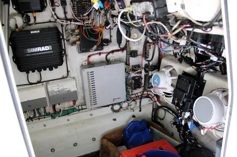 Slide: The Image of Electrical system inside a 2007 Yellowfin 36 Offshore boat, featuring wiring and equipment. - 41