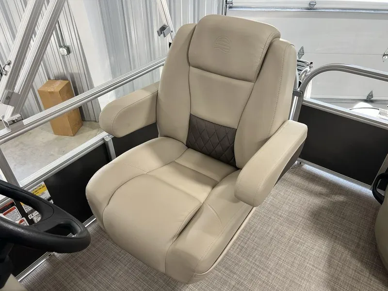 Slide: The Image of Captain's chair on 2025 Sun Tracker PARTY BARGE® 16 DLX pontoon boat, featuring beige upholstery. - 10