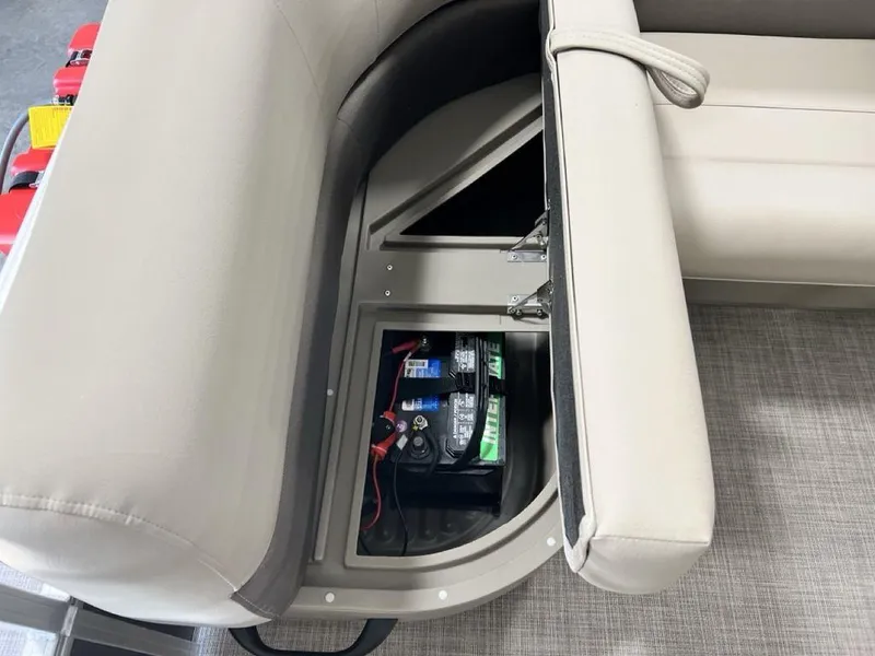 Slide: The Image of 2025 Sun Tracker PARTY BARGE® 16 DLX battery compartment under beige seating. - 13