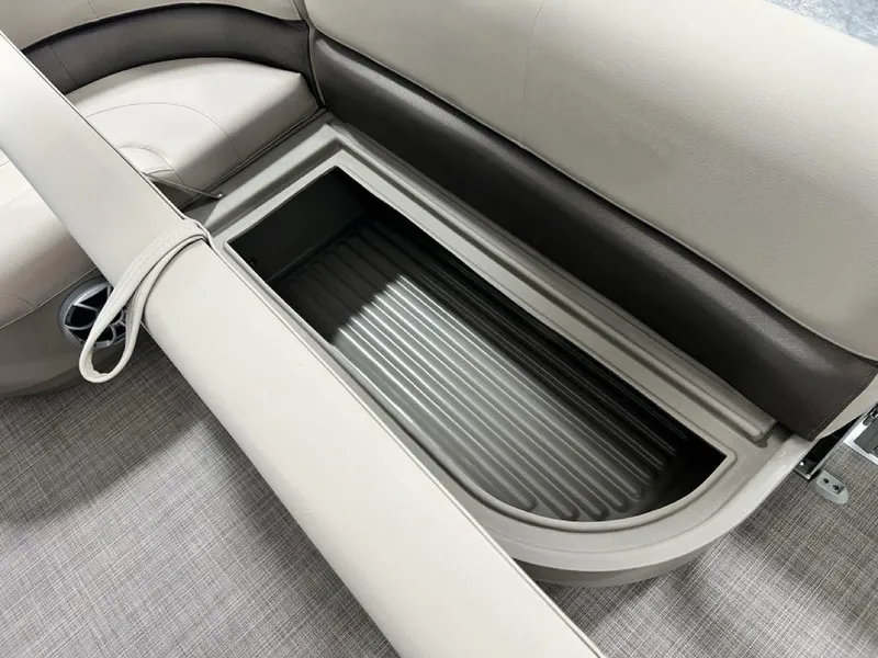Slide: The Image of 2025 Sun Tracker PARTY BARGE® 16 DLX storage compartment with cushioned seating. - 14